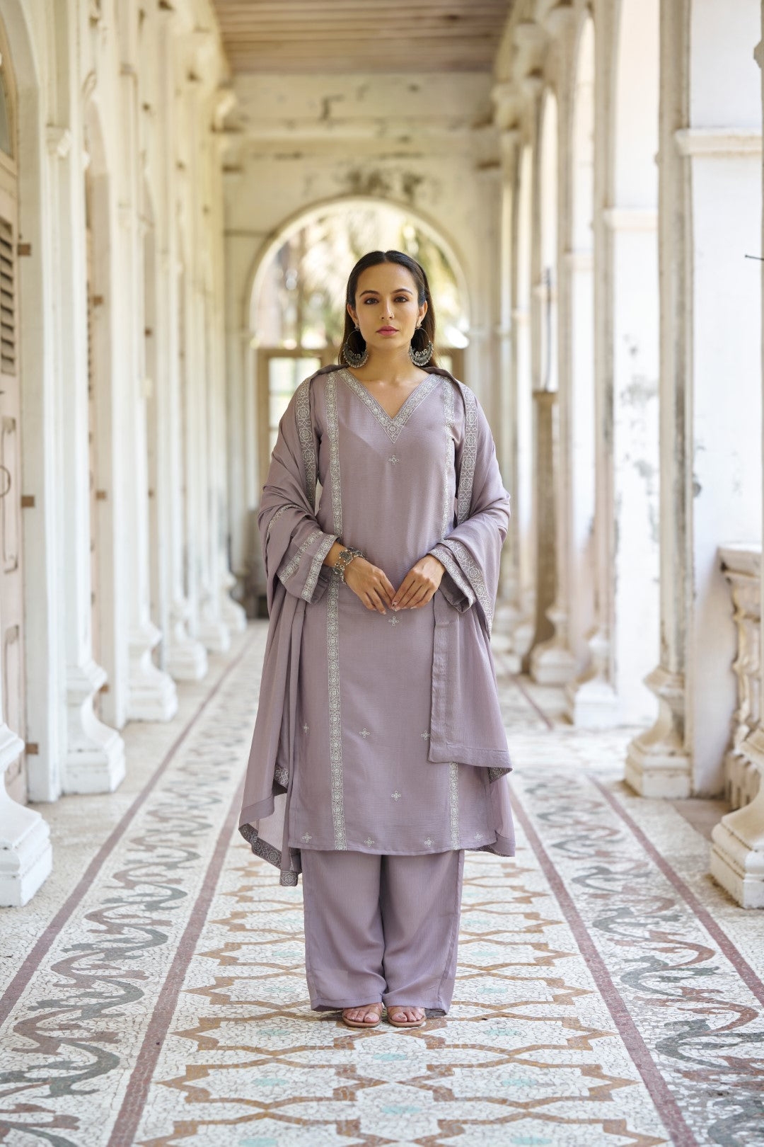 Model wearing a mauve chiffon suit