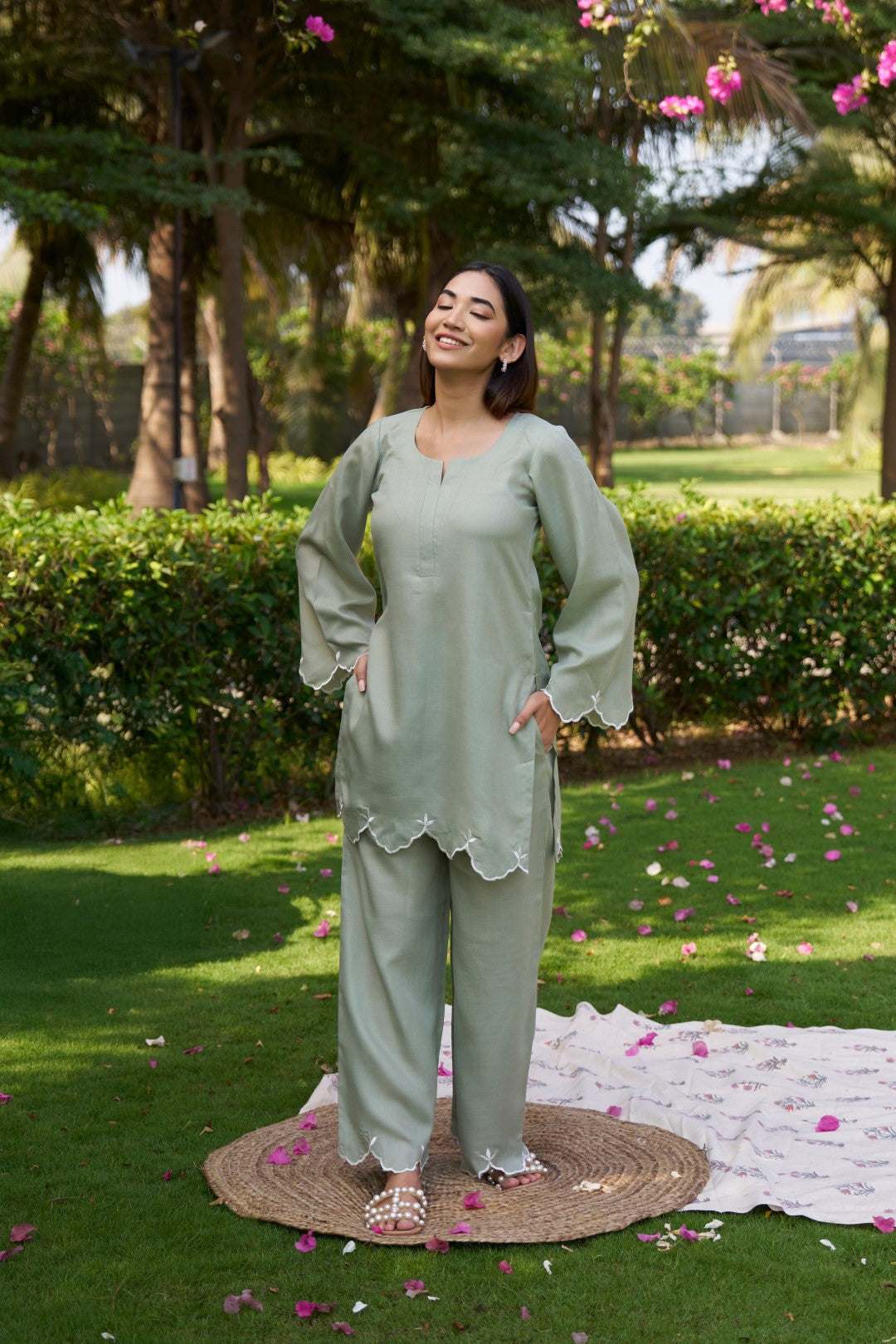 Model wearing a green Rajree two piece set